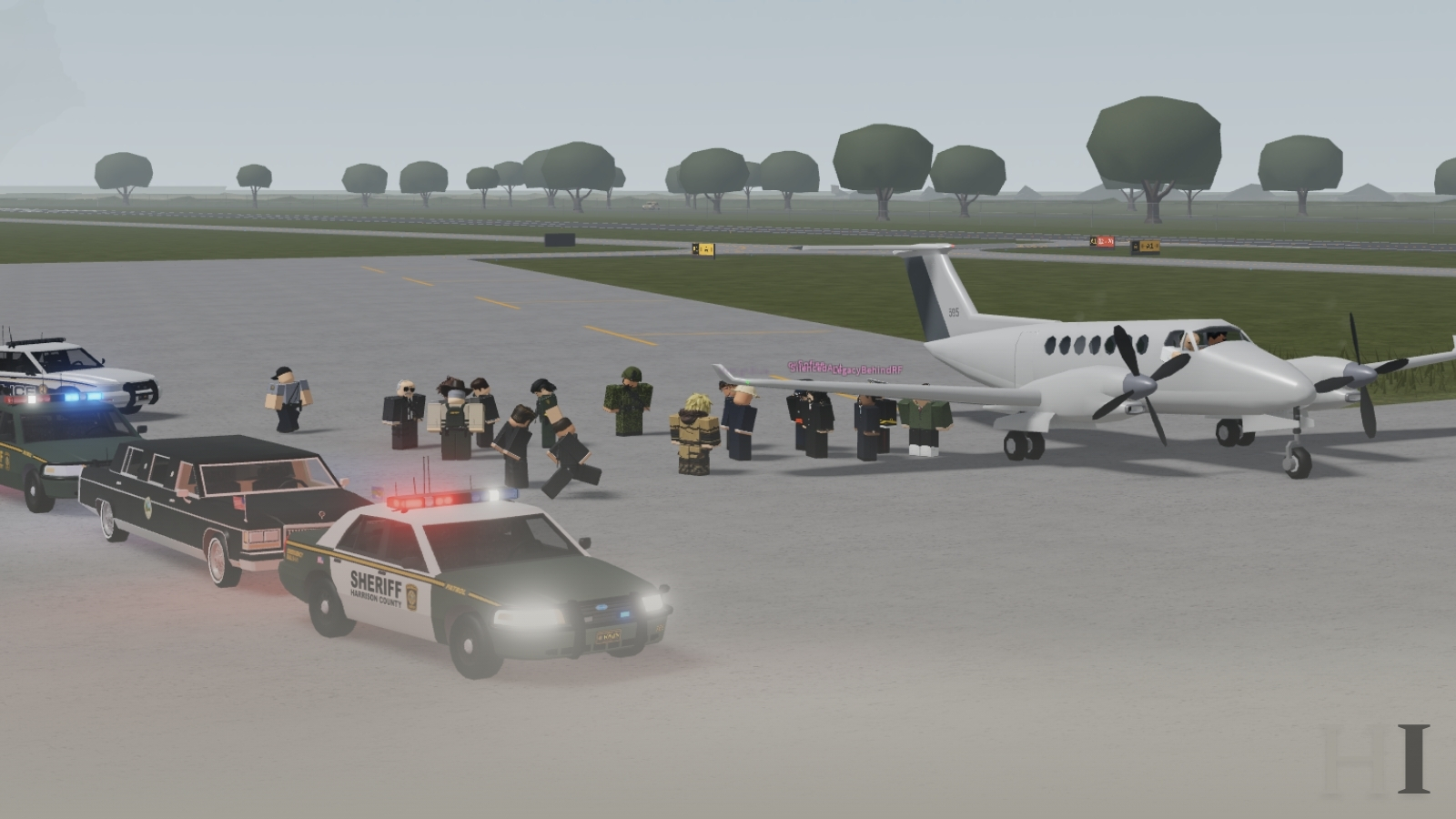 Harrison County officials, guardsmen, and sheriff's deputies gather beside an aircraft on the county airfield to receive the Dutch delegation.