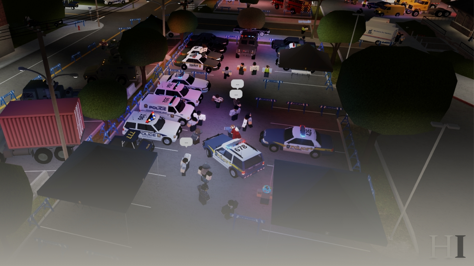 An elevated night view of a Jamestown lot filled with marked patrol cruisers, department tents, and emergency apparatus, with attendees walking between the displays.